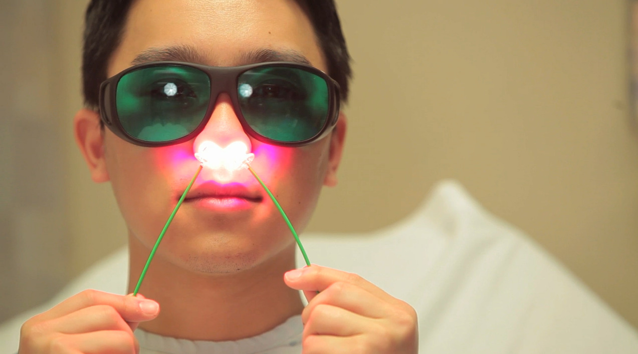 Targeted reduction of SARS-COV-2 viral load in the nose with photodisinfection may reduce severity of lower tract respiratory disease